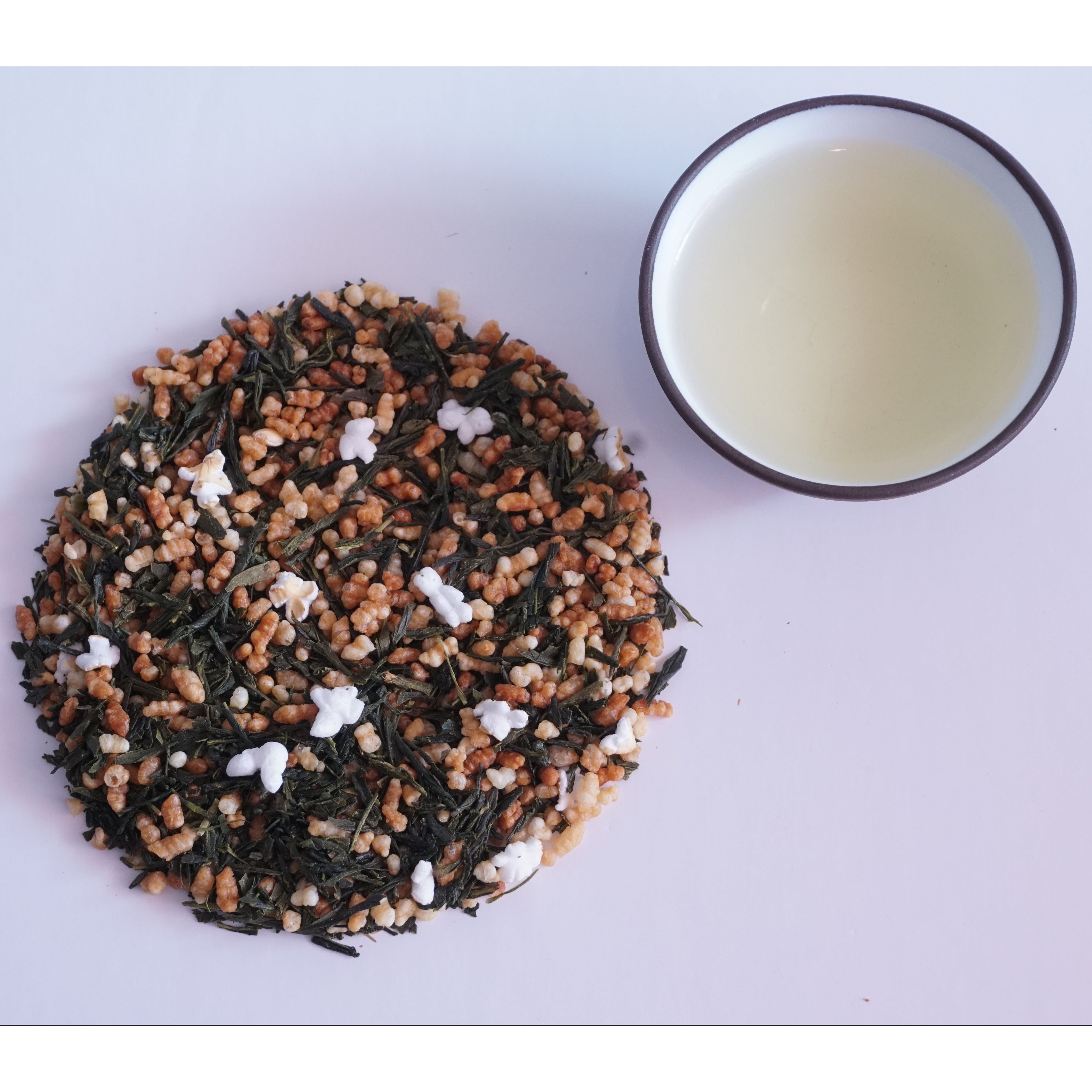 green tea with popped and roasted rice next to the liquor, pale beige