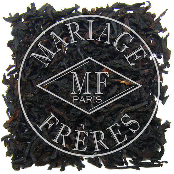 Black Orchid Organic Flavored Tea Mariage Freres Tea leaves on white background